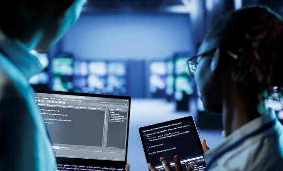 data-center-specialists-code-on-tablet-2024-01-03-01-02-38-utc